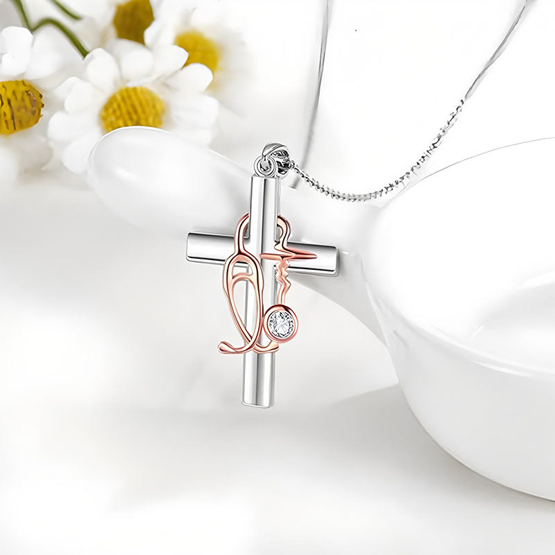 Origsoul nurse cross necklace with silver cross pendant and rose gold stethoscope detail on chain