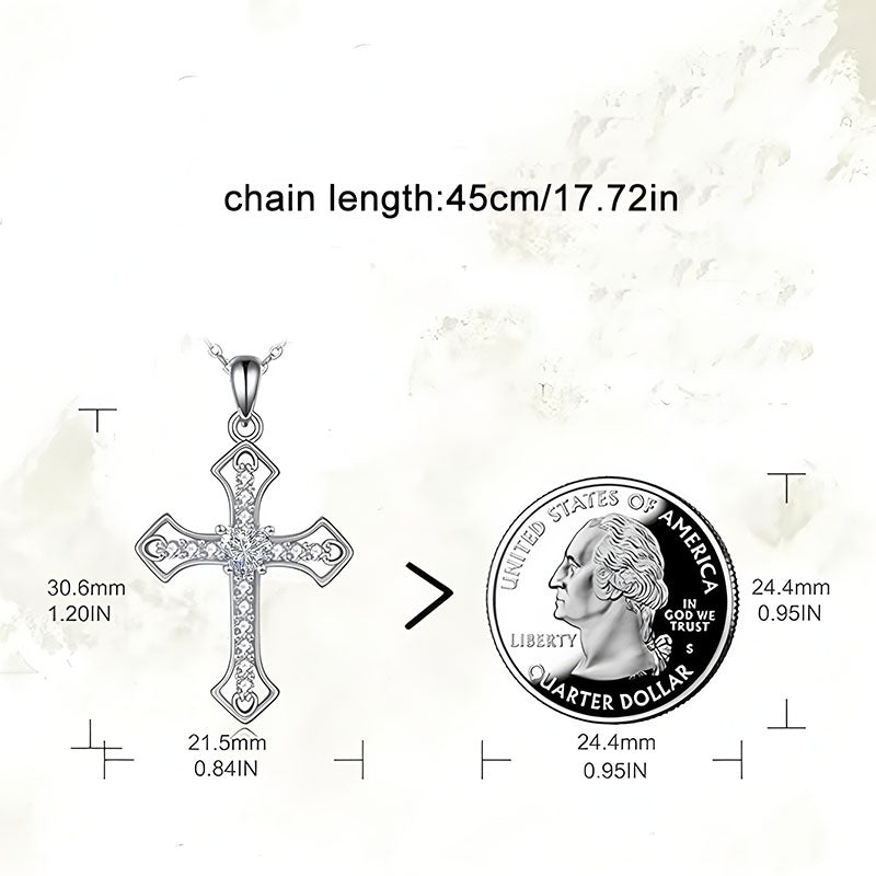 Origsoul sparkling cross pendant with detailed design next to a quarter for size reference