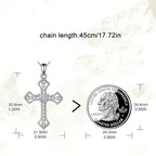 Origsoul sparkling cross pendant with detailed design next to a quarter for size reference