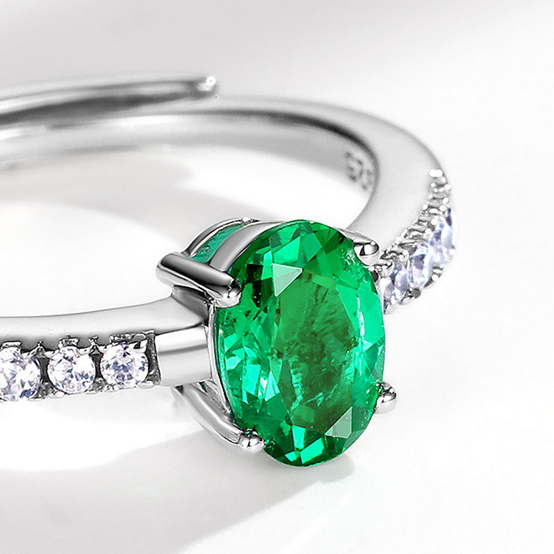 Origsoul silver sterling ring with large oval green gemstone and small clear stones on band