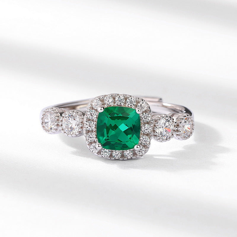 Origsoul silver sterling ring with a green square gemstone surrounded by small clear crystals