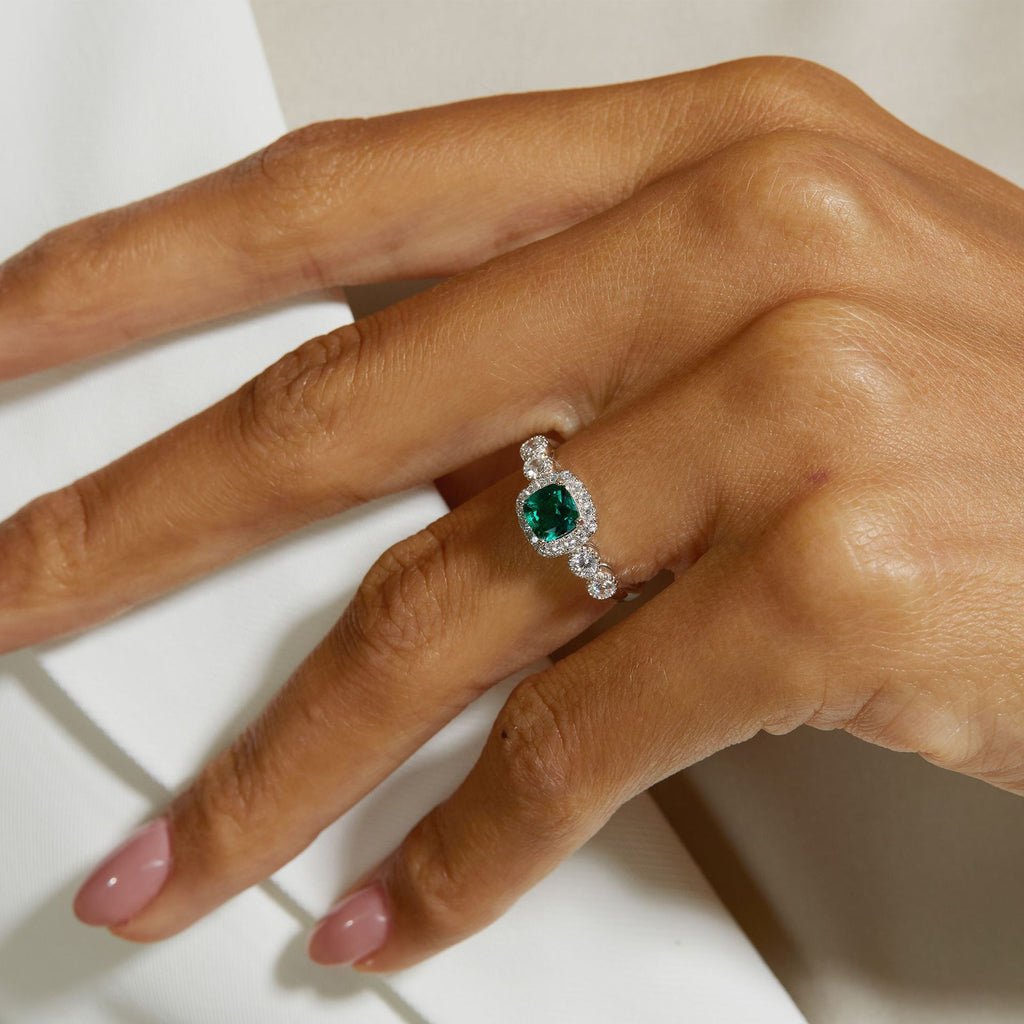 Origsoul silver sterling ring with green gemstone and diamond accents on hand