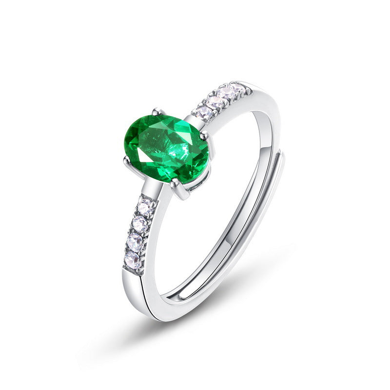 Origsoul silver sterling ring with oval green gemstone and small clear crystals on band