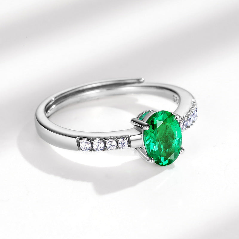 Origsoul silver sterling ring with a vibrant green oval gemstone and clear accent stones