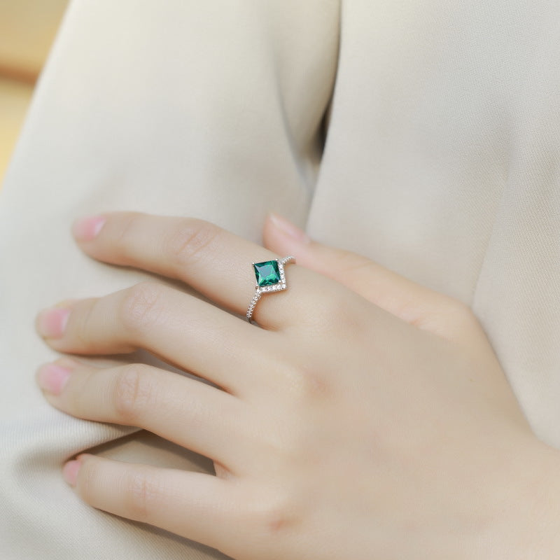 Origsoul silver sterling ring with green square gemstone on woman's hand