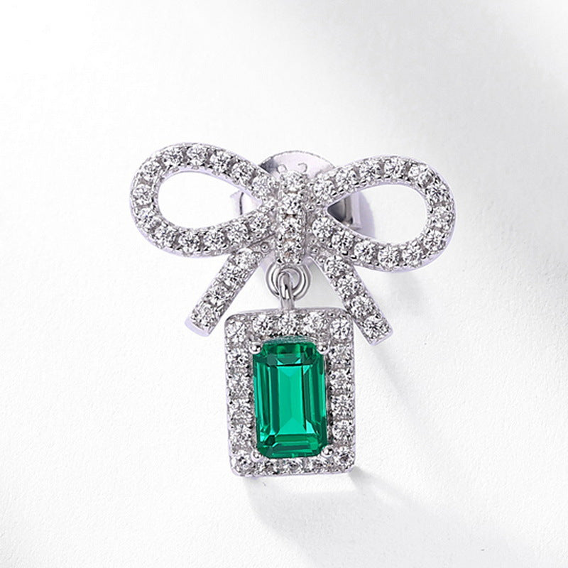 Origsoul silver sterling silver earrings with bow design and emerald green gemstone pendant