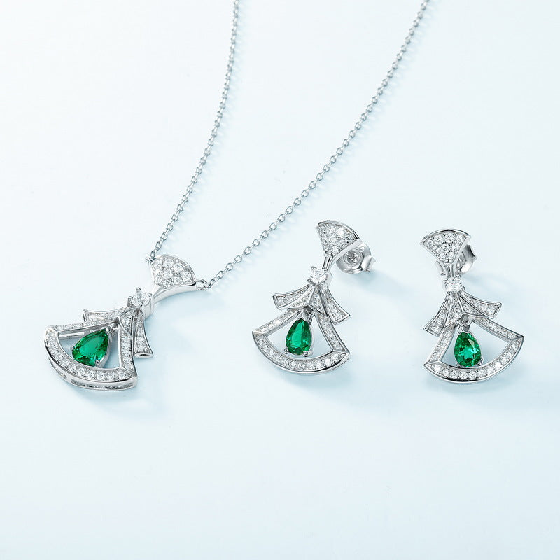 Origsoul silver sterling silver earrings and matching necklace with green gemstone accents