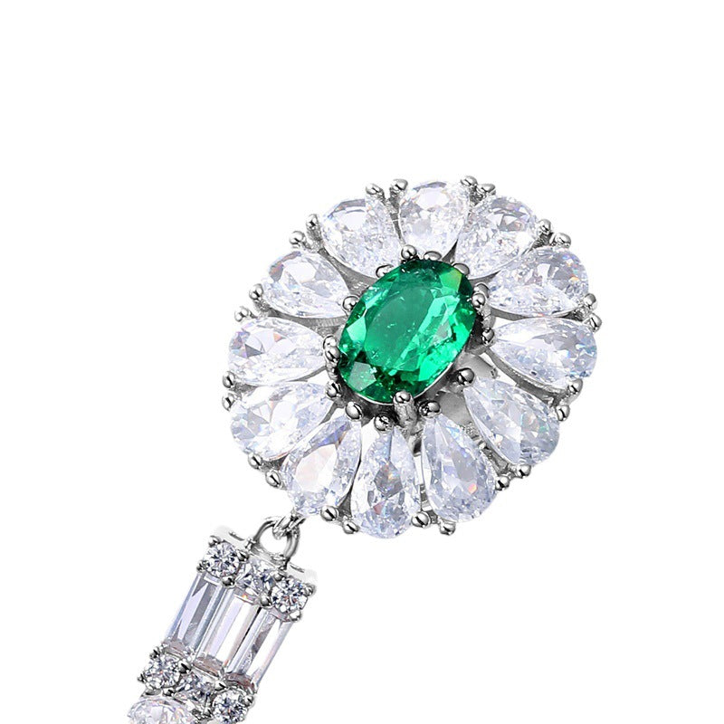 Origsoul silver sterling silver earrings featuring green oval gemstone surrounded by clear teardrop stones