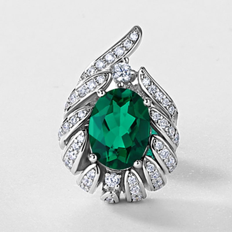 Origsoul silver sterling silver earrings with green gemstone and surrounding clear crystals