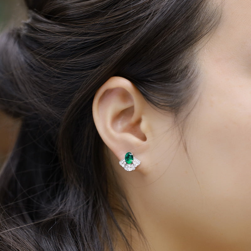 Origsoul silver sterling silver earrings with green gemstone and clear crystals on ear