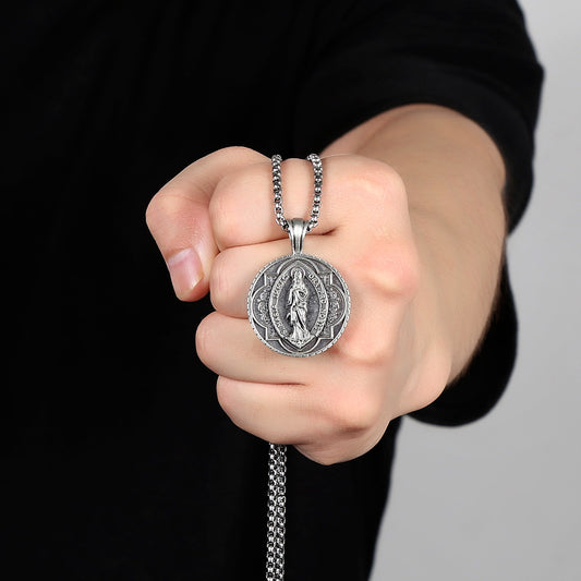 Origsoul Tranquil Spirit Collection Virgin Mary necklace held in hand with intricate pendant design