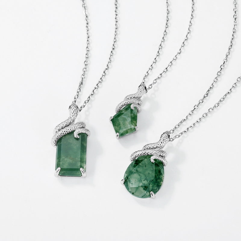 Origsoul jewelry set featuring three silver necklaces with unique moss agate pendants in different shapes