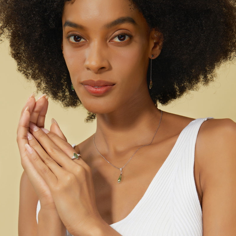 Origsoul sterling necklace silver worn by woman with white top and matching earrings