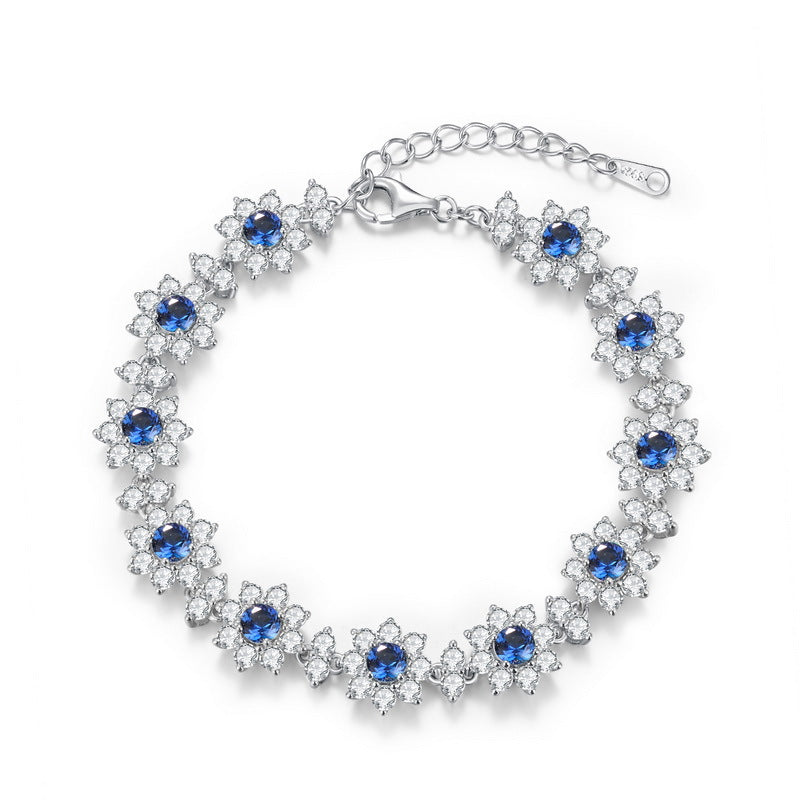 Origsoul sterling silver bracelet with blue and clear gemstone flower design and adjustable clasp