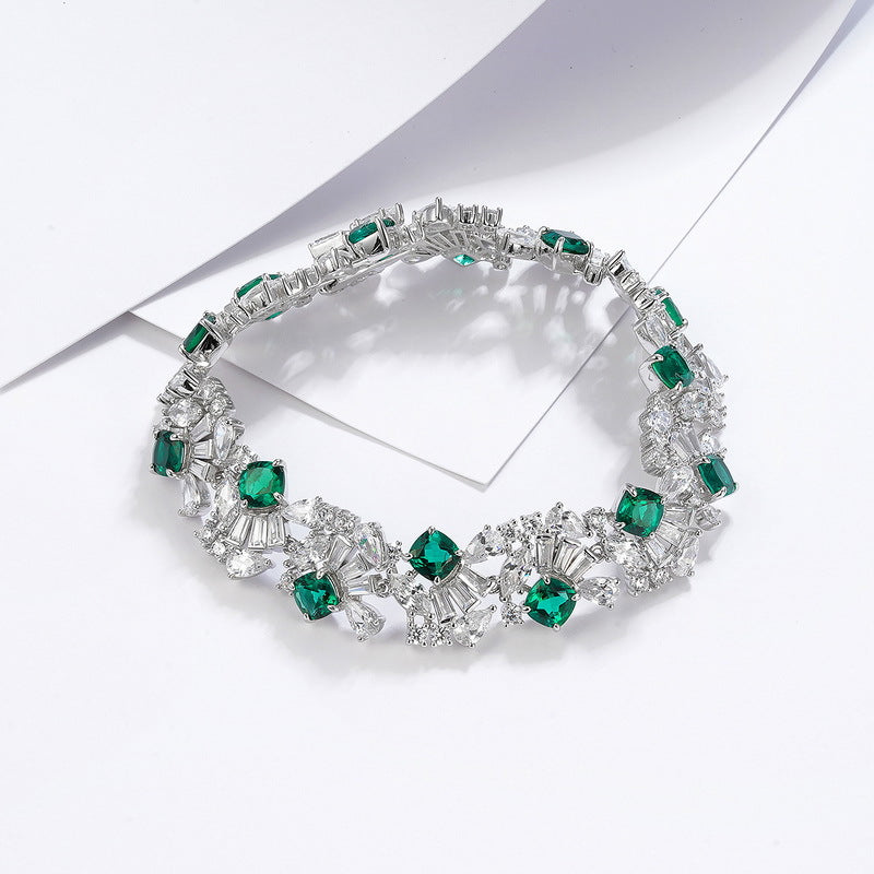 Origsoul sterling silver bracelet pandora with green and clear gemstone accents on white background
