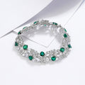 Origsoul sterling silver bracelet pandora with green and clear gemstone accents on white background