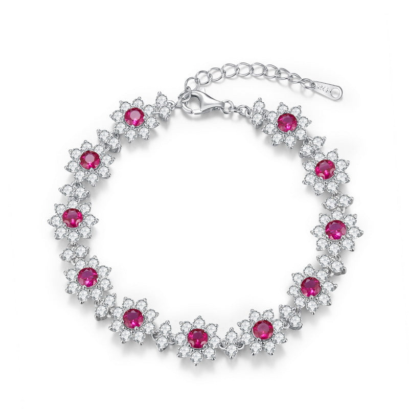 Origsoul sterling silver bracelet with red gemstones and clear crystal flower design