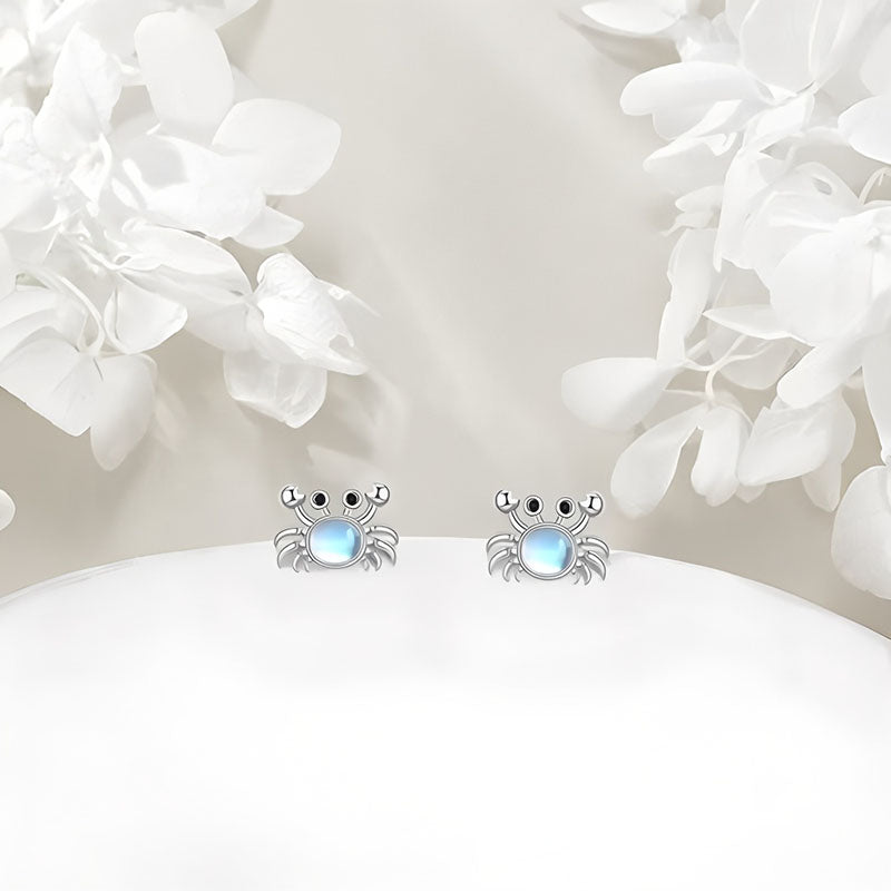 Origsoul sterling silver crab earrings with a blue gemstone accent for a playful ocean-inspired look