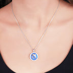 Origsoul sterling silver dolphin pendant necklace with blue enameled design hanging on a chain