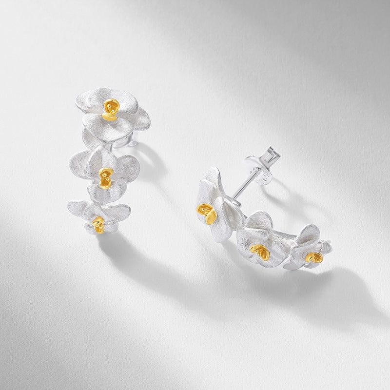 Origsoul sterling silver earrings with delicate flower design and gold accents for elegant style