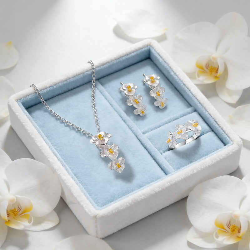Origsoul sterling silver earrings set with matching floral necklace and ring in white gift box