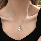 Origsoul sterling silver elephant heart necklace on a model, showcasing its elegant design