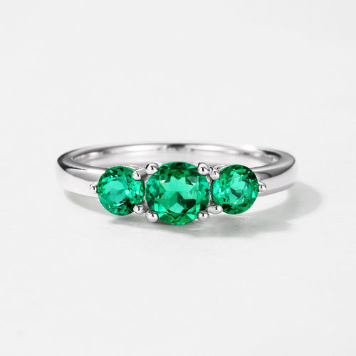 Origsoul engagement ring emerald cut featuring three vibrant green emerald gemstones on a silver band