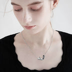 Origsoul sterling silver fox koala necklace showcased on a model with a stylish black top