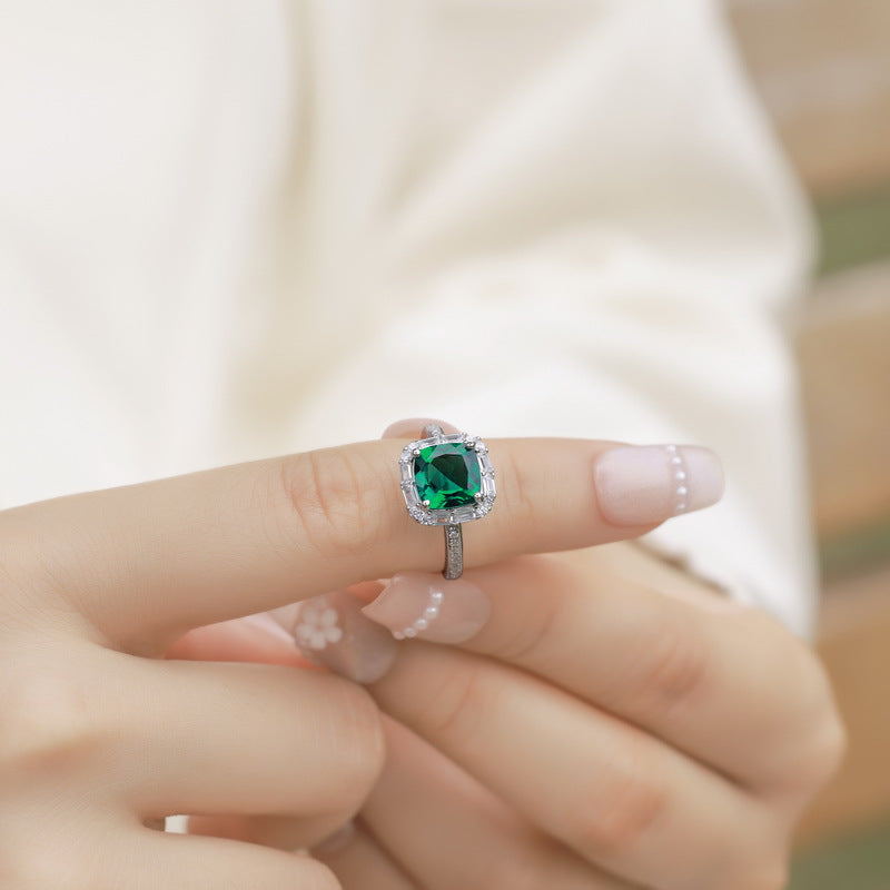 Origsoul sterling silver jelwery ring with green gemstone worn on finger