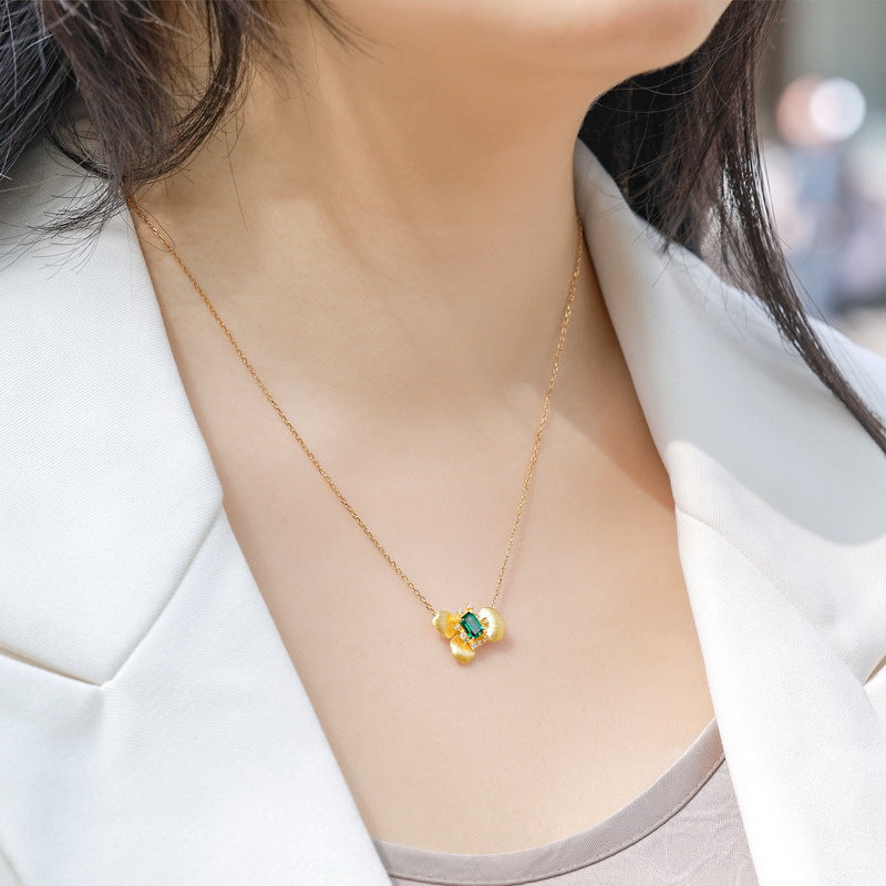 Origsoul sterling silver jelwery gold chain necklace with green gemstone pendant worn on neck