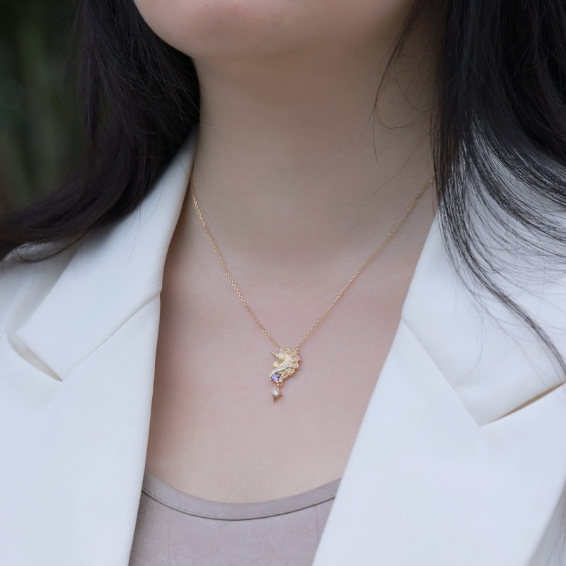 Origsoul sterling silver jelwery seahorse pendant necklace worn with white blazer and taupe top