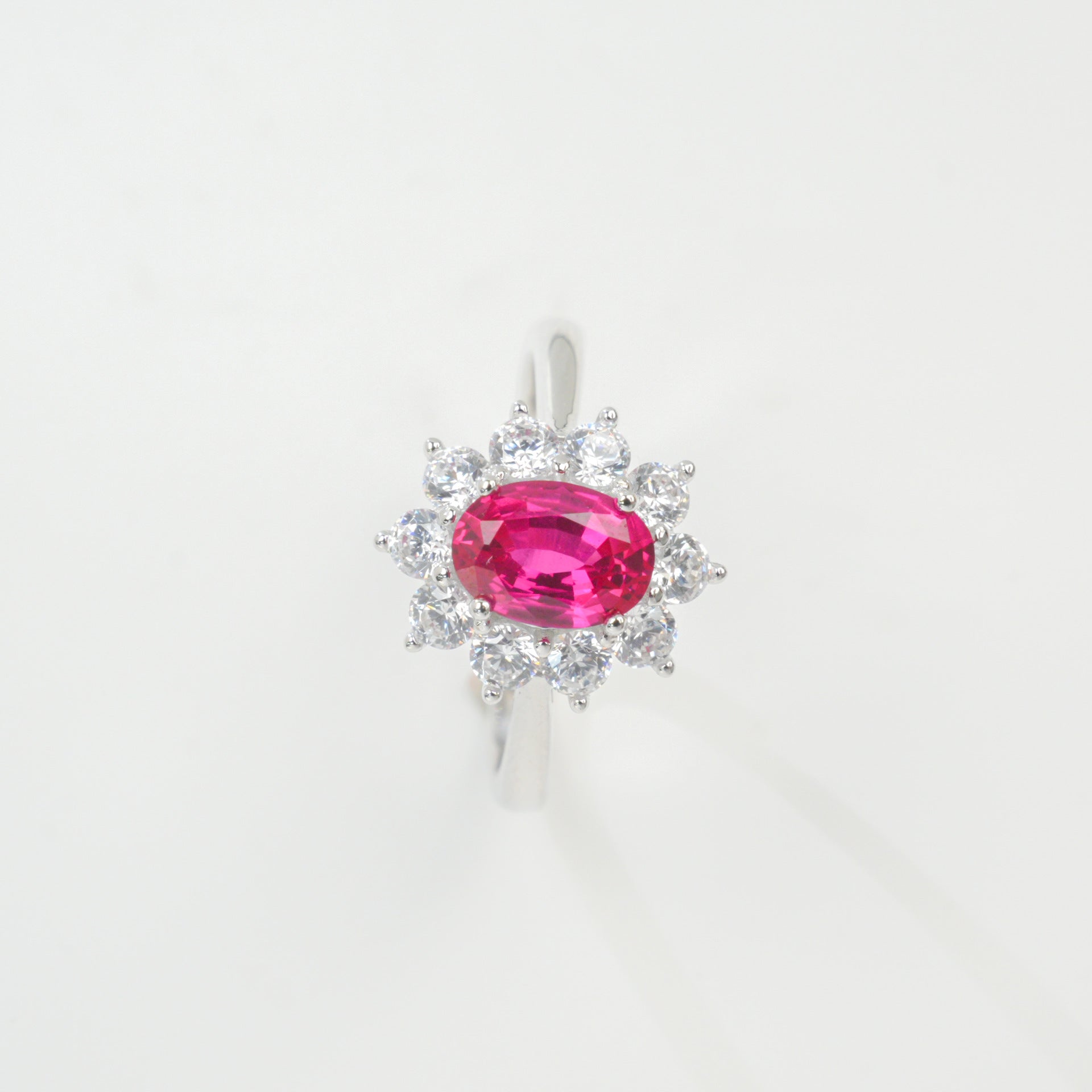 Origsoul sterling silver jelwery ring with oval pink gemstone surrounded by clear crystals