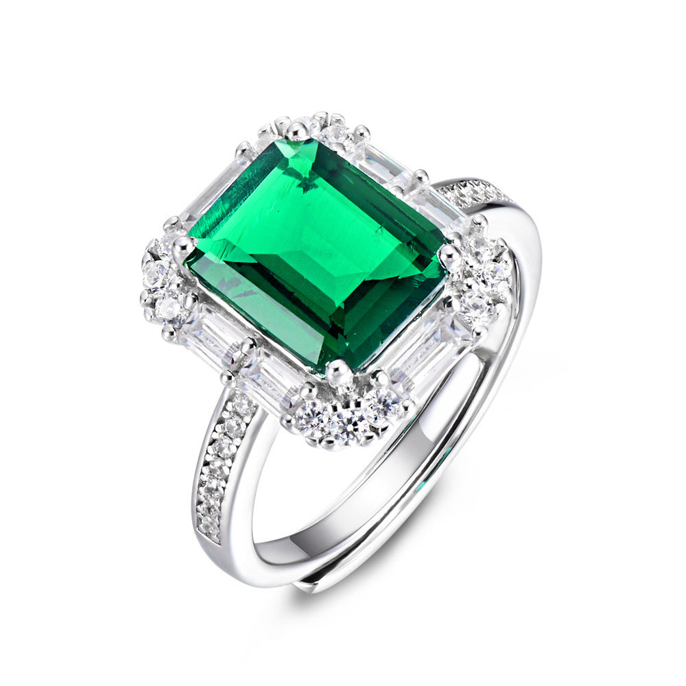 Origsoul sterling silver jelwery ring with a large green emerald-cut stone and surrounding clear crystals