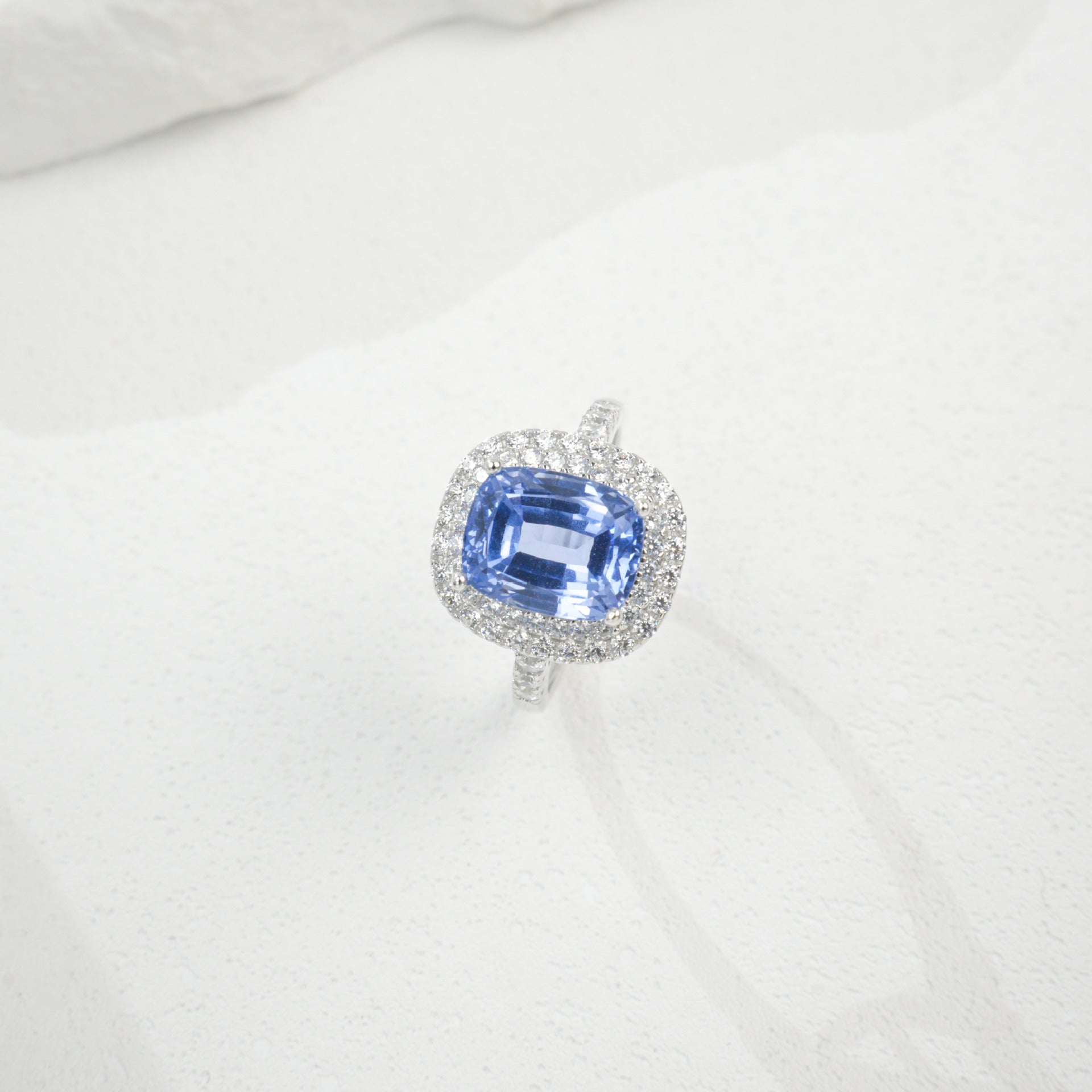 Origsoul sterling silver jelwery ring with blue gemstone and surrounding small clear stones