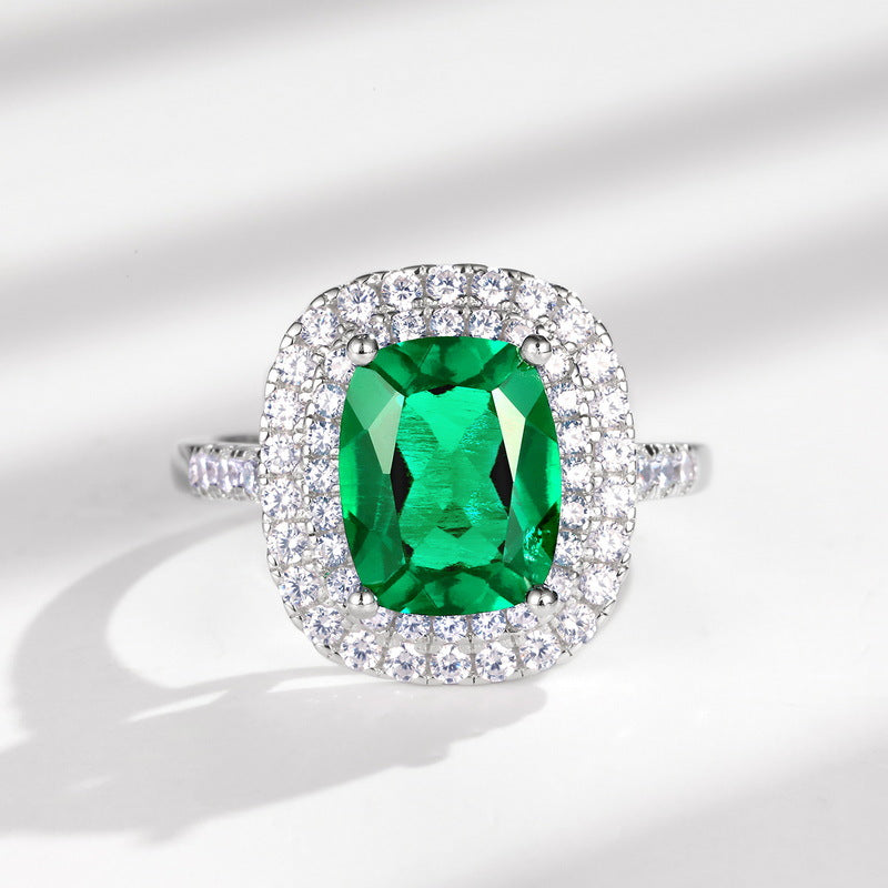 Origsoul sterling silver jelwery ring with large green gemstone surrounded by smaller clear stones