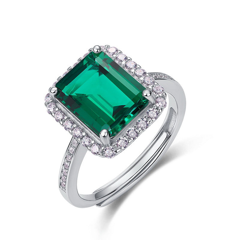 Origsoul sterling silver jewerly ring with large emerald-cut green gemstone and surrounding clear stones