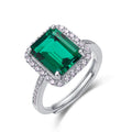 Origsoul sterling silver jewerly ring with large emerald-cut green gemstone and surrounding clear stones