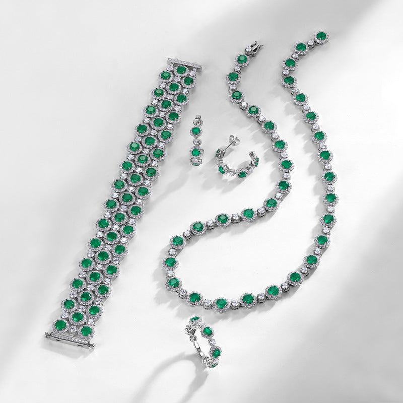 Origsoul sterling silver jewerly set with green gemstones including bracelet, necklace, earrings, and ring