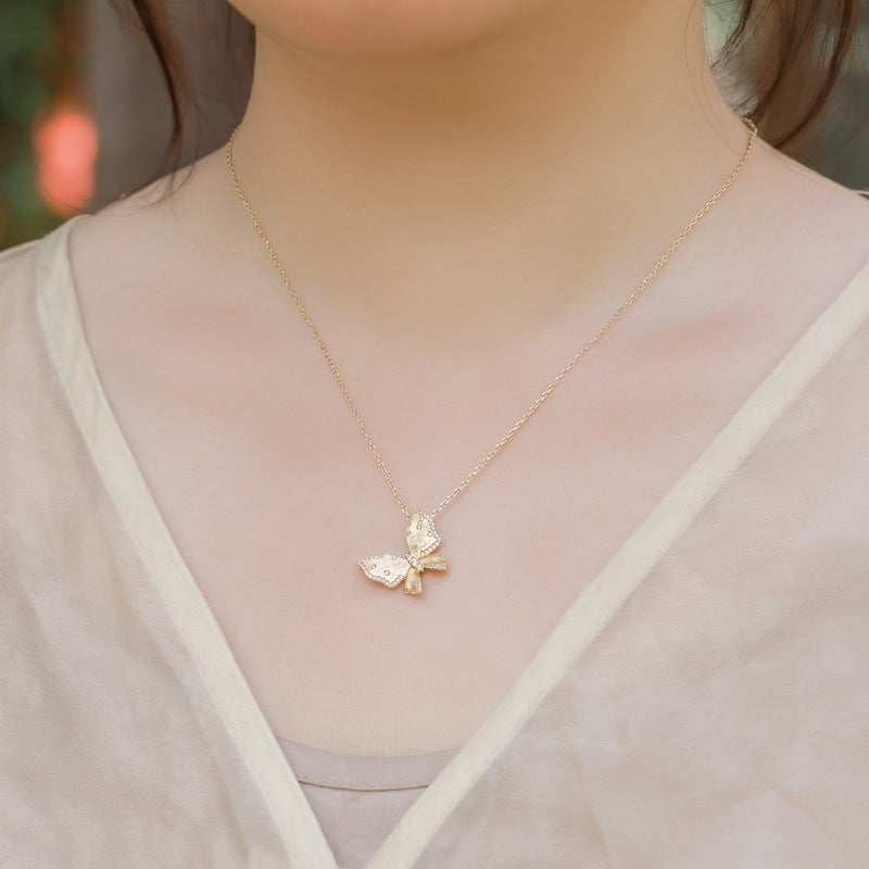 Origsoul sterling silver necklace with delicate butterfly pendant worn on neck