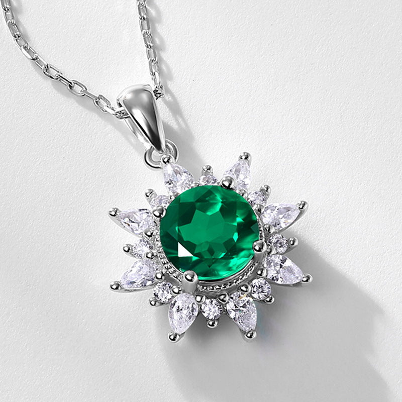 Origsoul sterling silver necklace with a green gemstone center surrounded by clear crystal accents