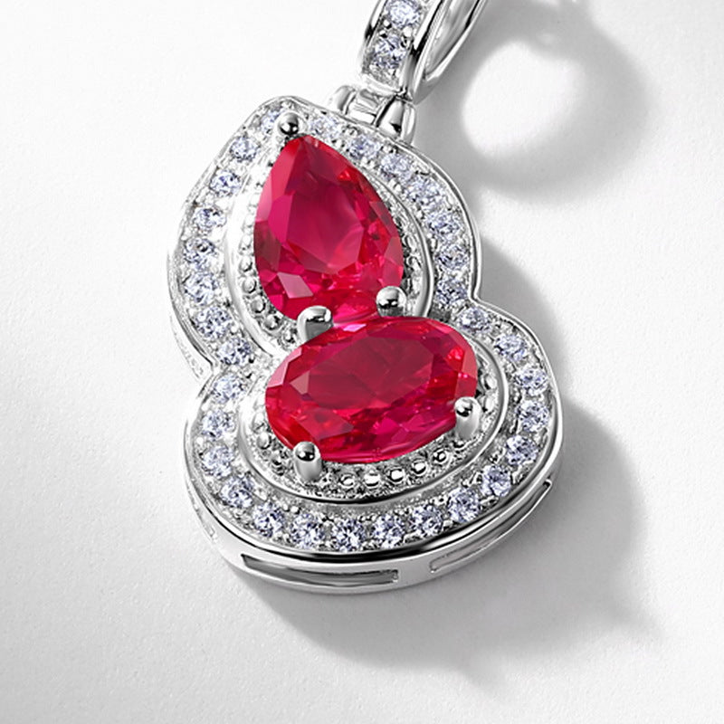 Origsoul sterling silver necklace pendant with red gemstones and surrounding clear crystals