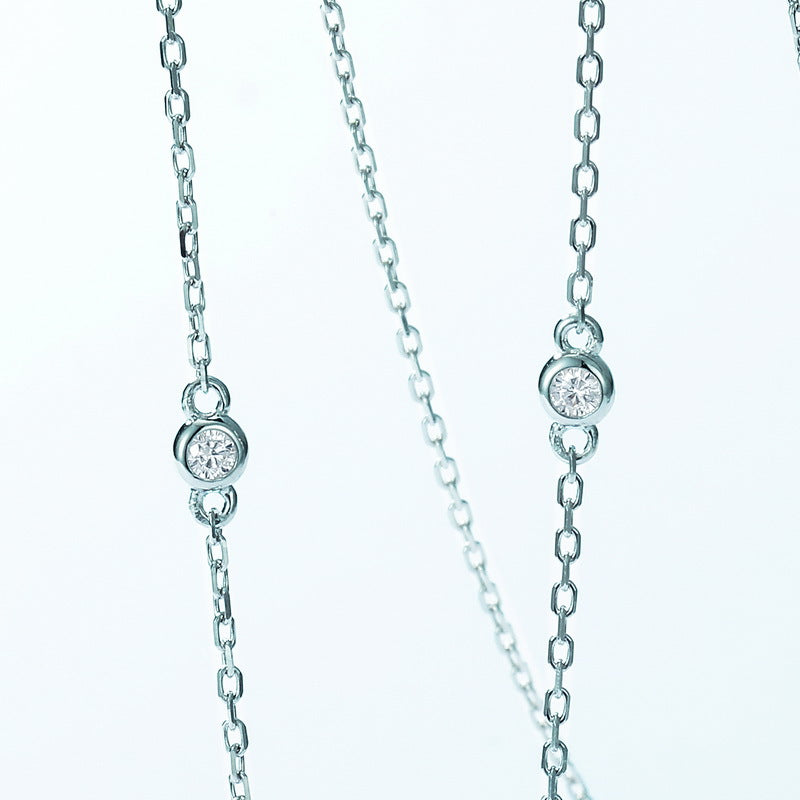Origsoul sterling silver necklace with delicate chain and small bezel-set clear gemstones
