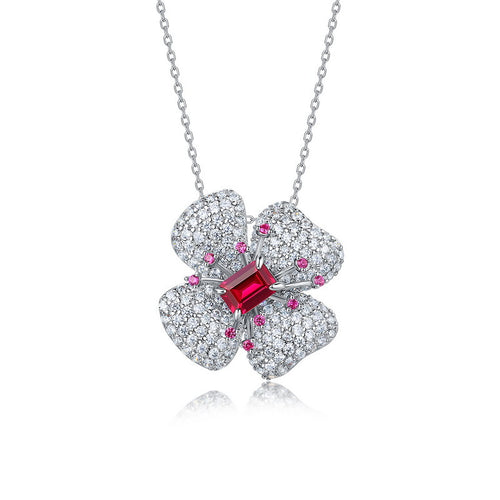 Origsoul sterling silver necklace with a flower pendant adorned with clear and red gemstones