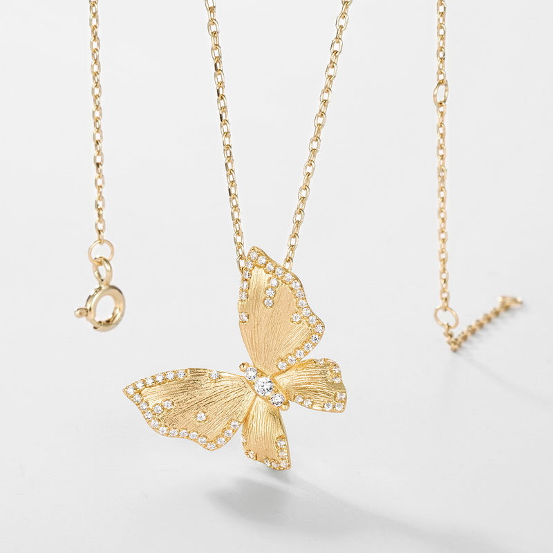 Origsoul sterling silver necklace with gold butterfly pendant adorned with small crystals