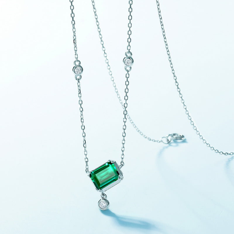 Origsoul sterling silver necklace with emerald cut green gemstone and small round accents