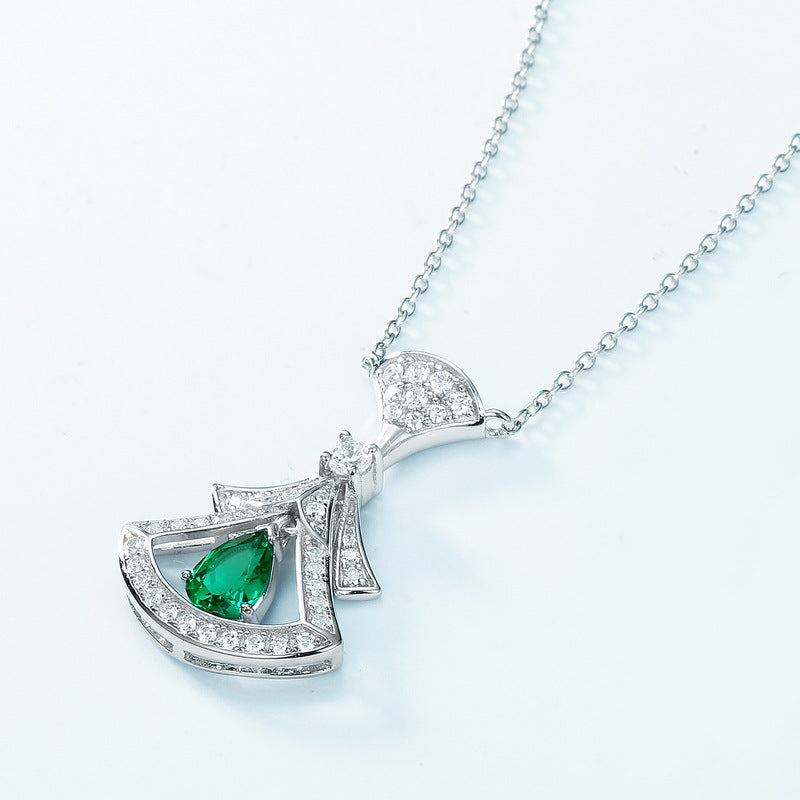 Origsoul sterling silver necklace with angel pendant featuring green gemstone and clear crystals