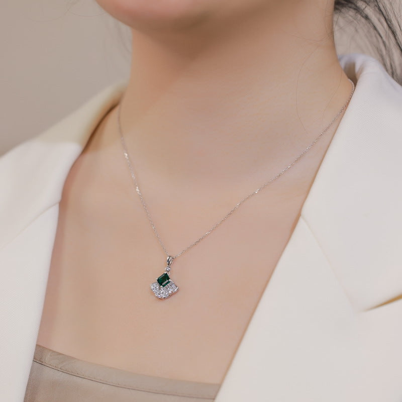 Origsoul sterling silver necklace with green and clear gemstone pendant worn on neck