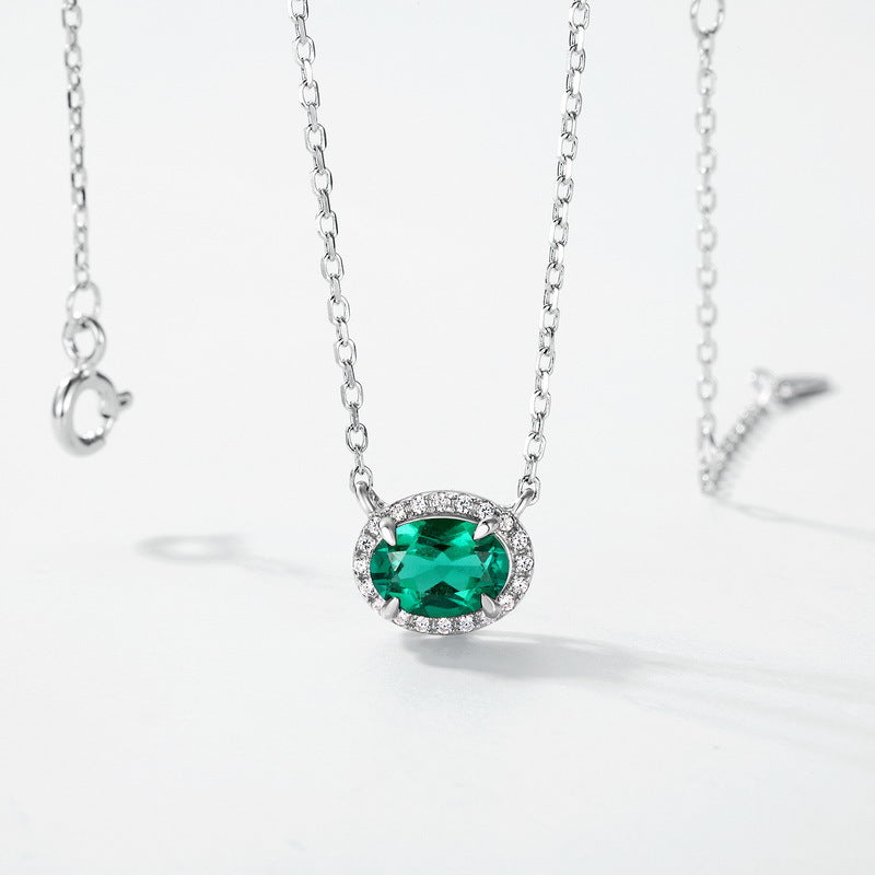 Origsoul sterling silver necklace with oval green gemstone pendant surrounded by small clear stones
