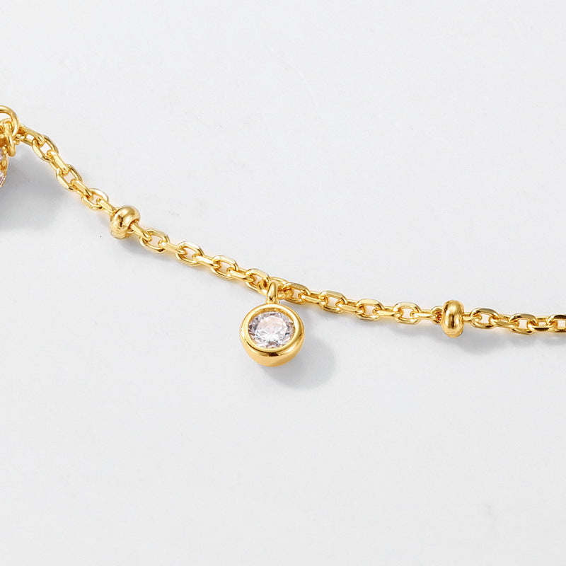 Origsoul delicate necklace in sterling silver with gold chain and small clear gemstone pendant