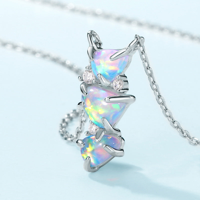 Origsoul sterling silver necklace with three heart-shaped opal stones and sparkling accents